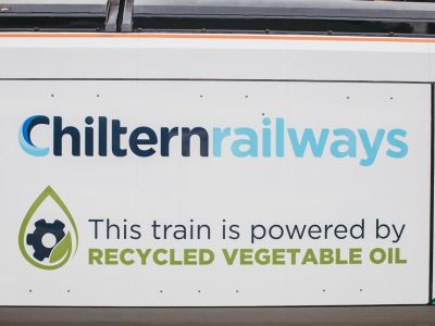 Side of train saying "this train is powered by recycled vegetable oil"