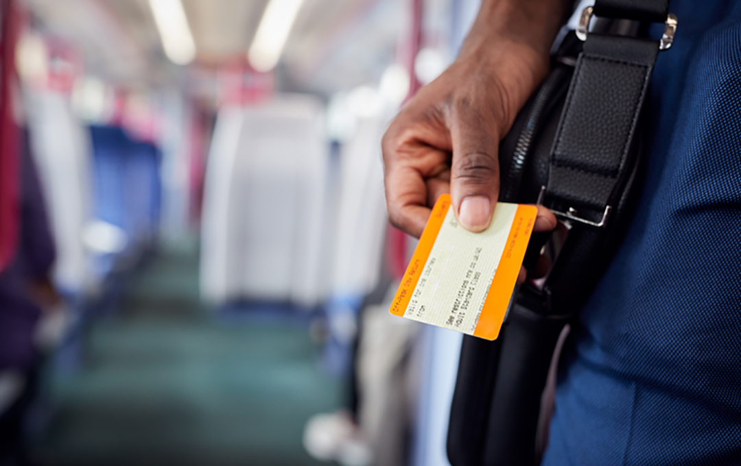 man holding ticket