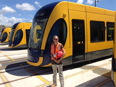 Susie Homan in front of trains