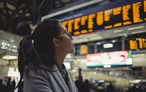 woman looking at departure board